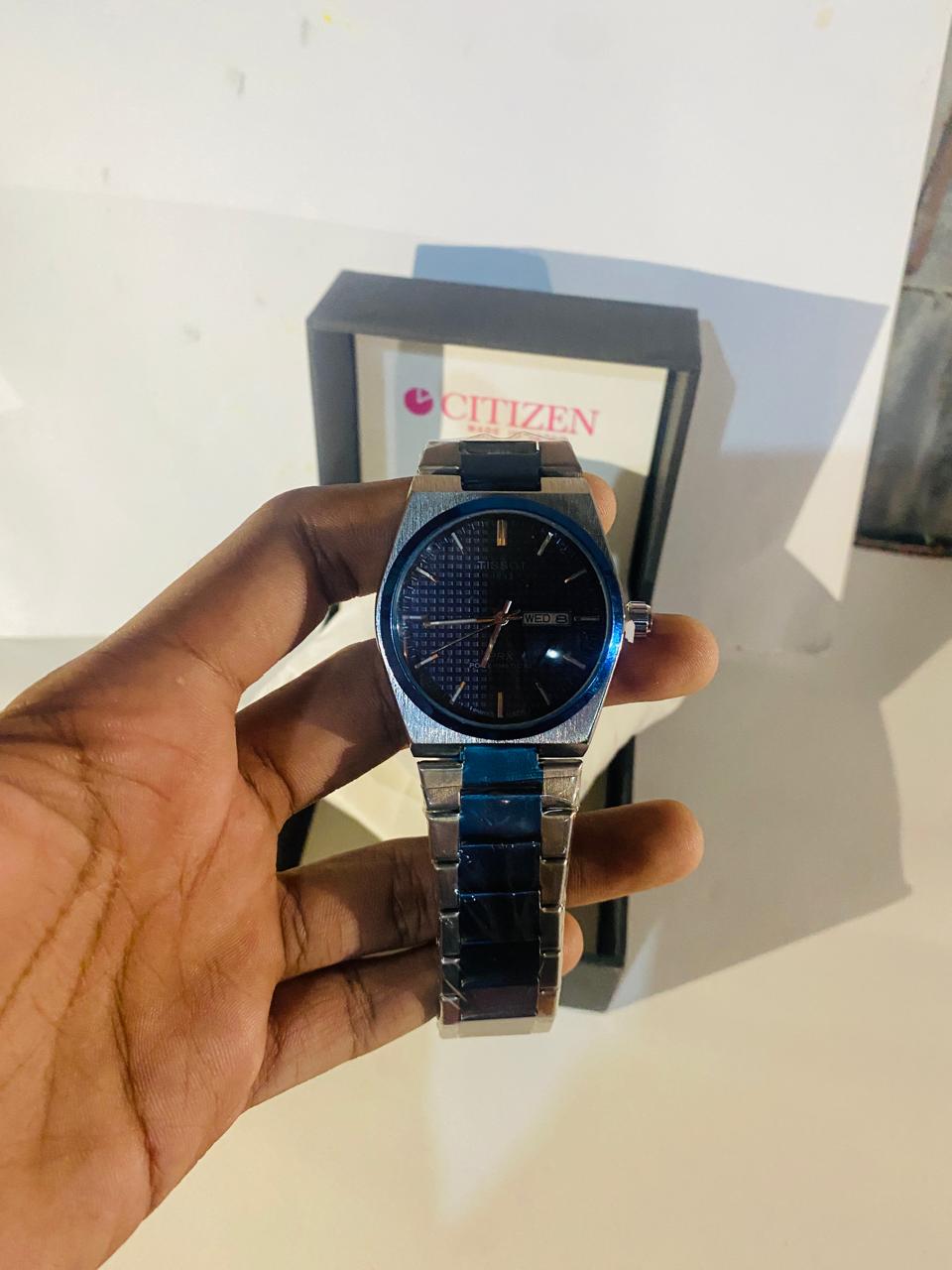 Tissot blue and silver watch