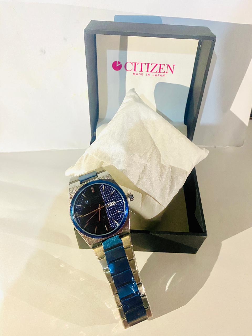 Tissot blue and silver watch